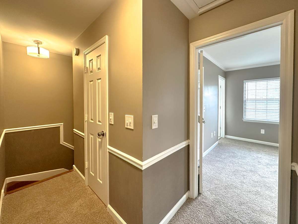 Wide stairwell to the upper living area.