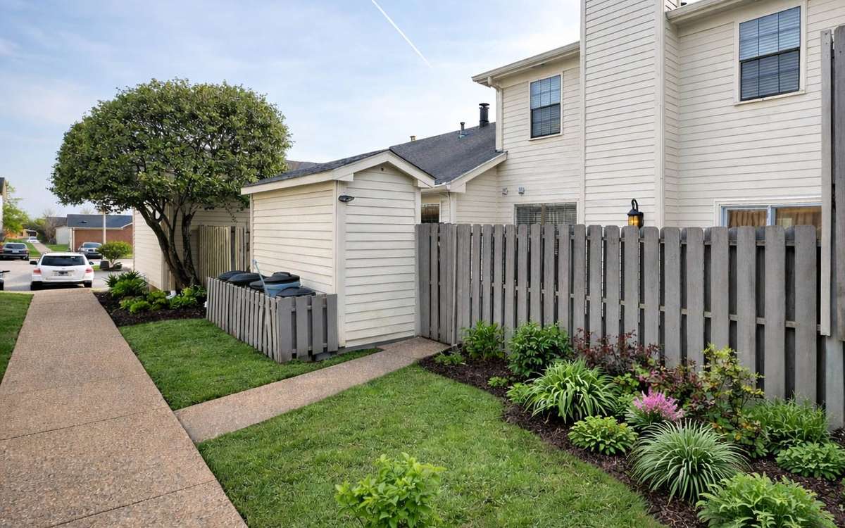 Just beyond the courtyard is a walkway that leads to green space, a garden, and access to trash that is picked up for your convenience.
