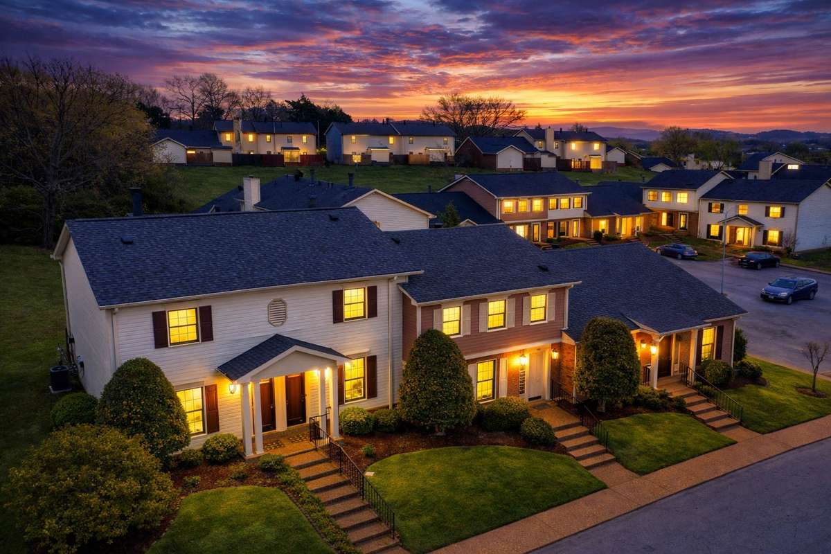 Aerial view of the property, highlighting serene surrounding hillsides, a beautiful place to come home to.