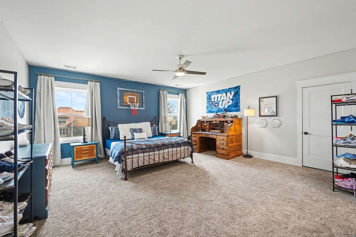 This upstairs bedroom has an ensuite and could be used as a secondary primary suite. Walkout storage is off this room. Walk in closet.