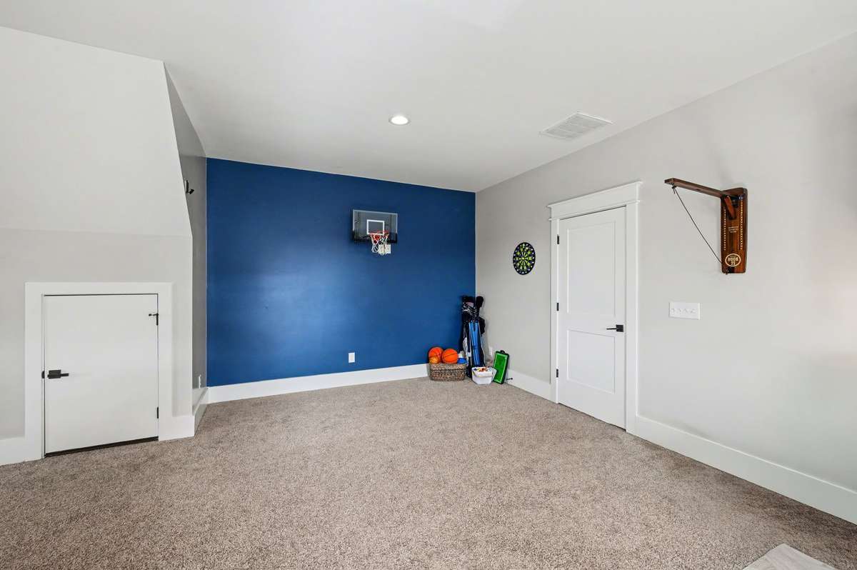 Upstairs** second laundry area in the bonus room (teen suite shown) This versatile space features custom storage and generous counter space for sorting and folding laundry or make this a hobby room or office. Built in under counter beverage cooler.