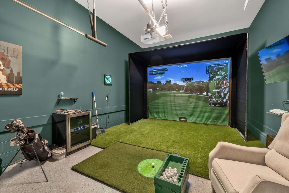 Single bay garage is currently converted to a gold simulator. Equipment does not convey, but is negotiable. Or sellers will convert this back to a 3rd bay garage.