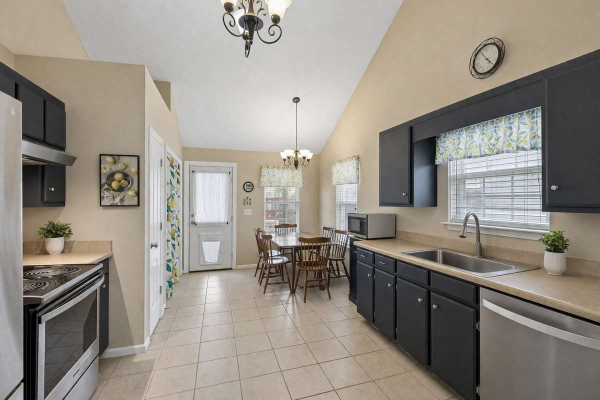 Large eat in kitchen with vaulted ceiling, pantry, & tile floors. 2739 Oxford Hall Ave. Murfreesboro, TN 37128