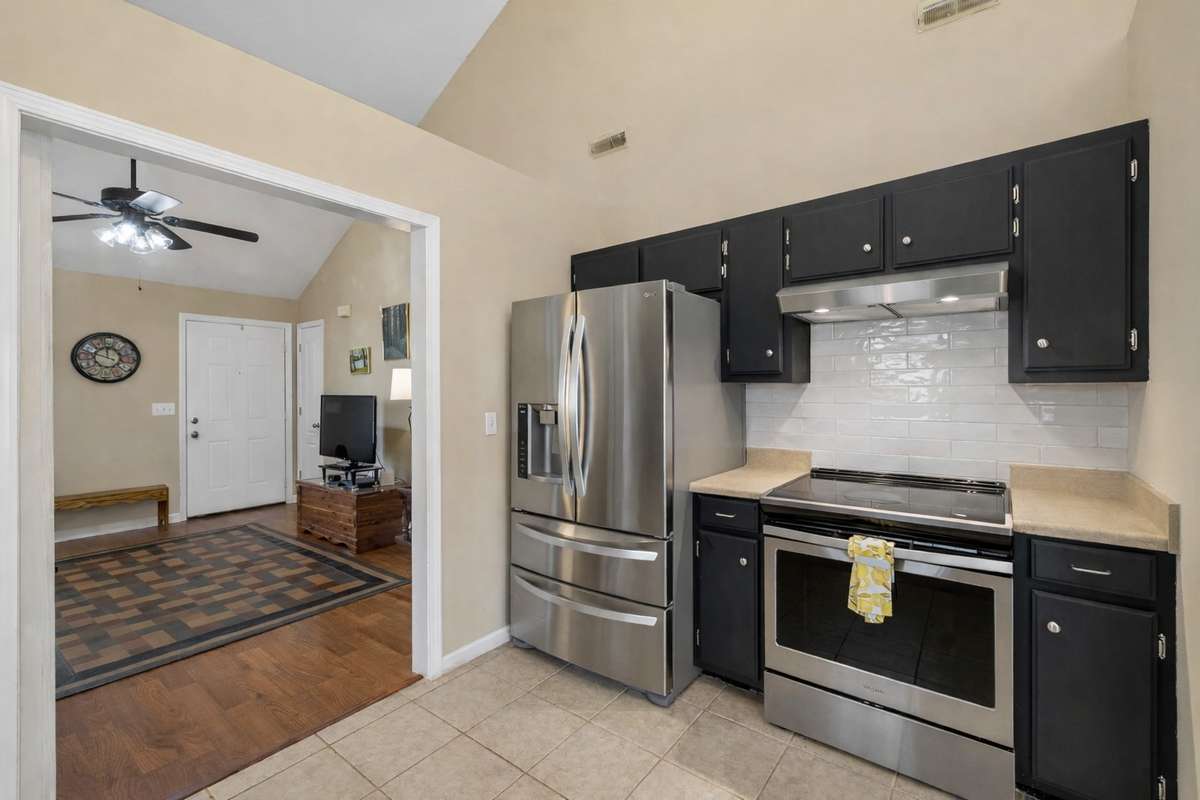Another view of your kitchen with subway tile backsplash, SS appliances including refrigerator remain! 2739 Oxford Hall Ave. Murfreesboro, TN 37128