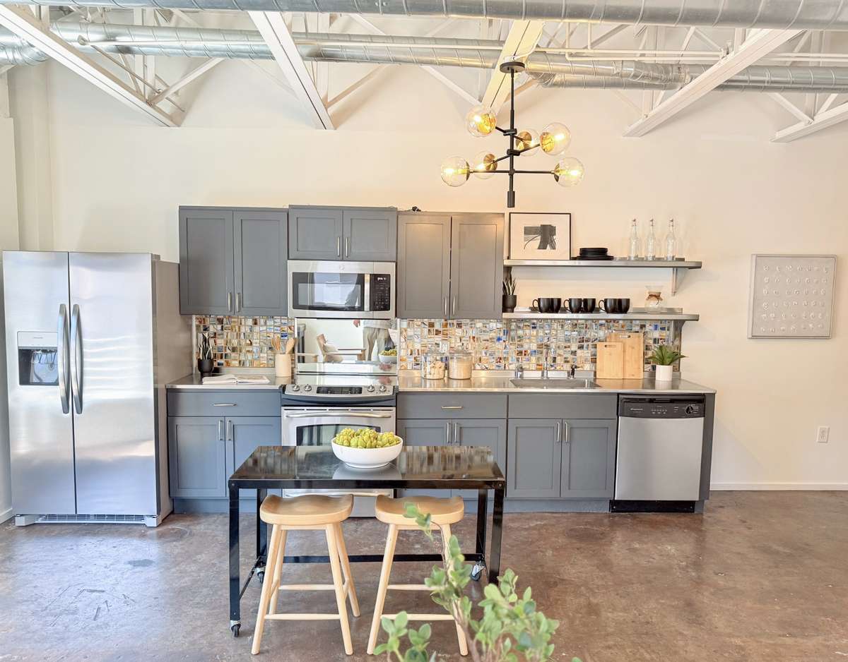 Modern chef's kitchen with updated appliances and functional design. Great space for entertaining.