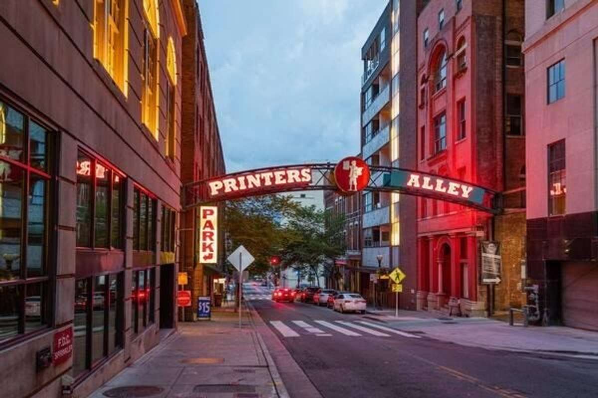 Iconic Printers Alley neon sign at the bae of the Banner Block Exchange Building