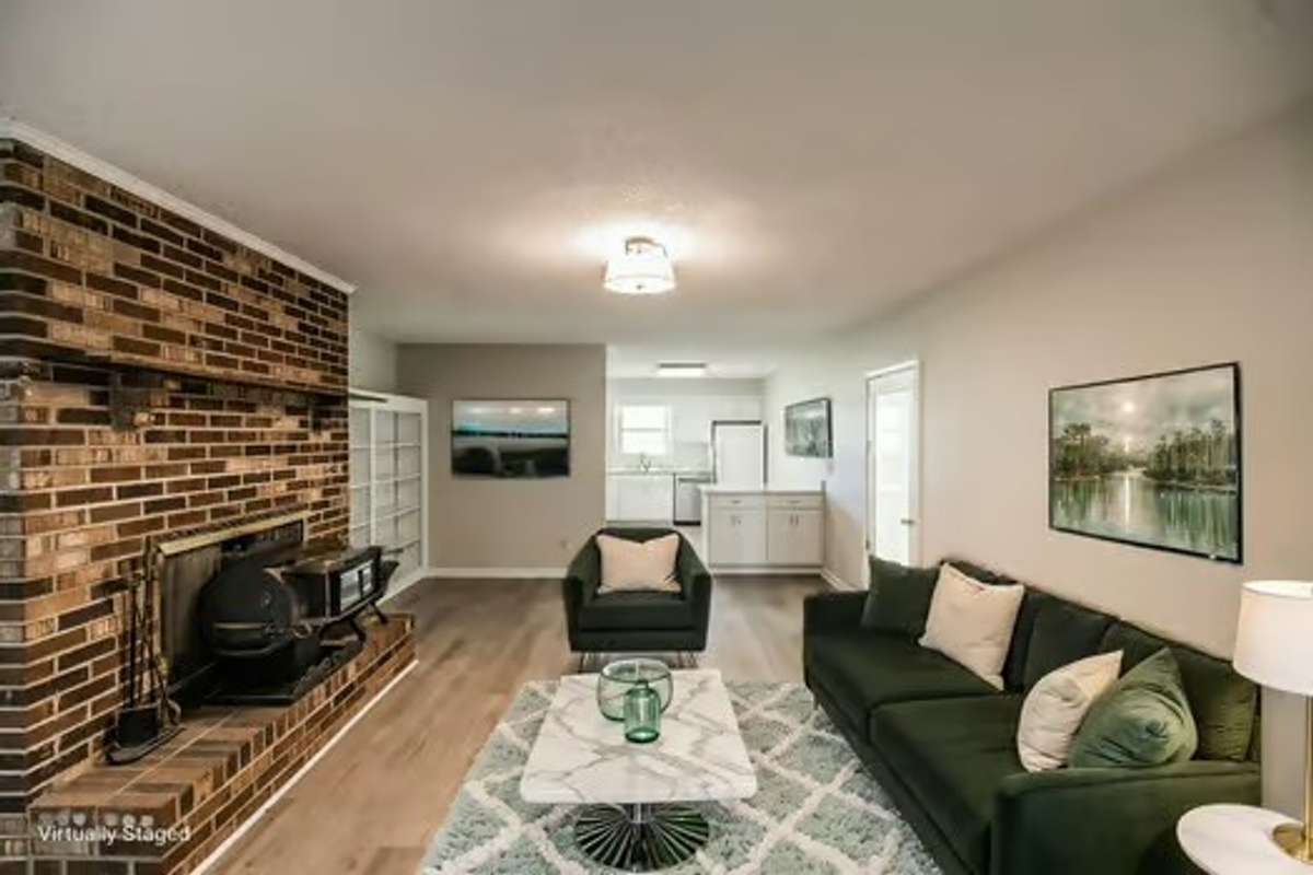 Virtual staging of the great room open to the kitchen