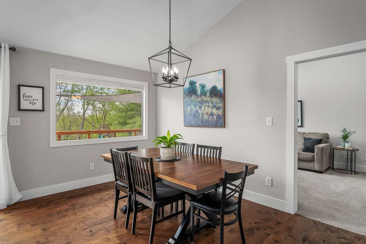 Enjoy gathering for meals in this dining area in front of the huge picture window.