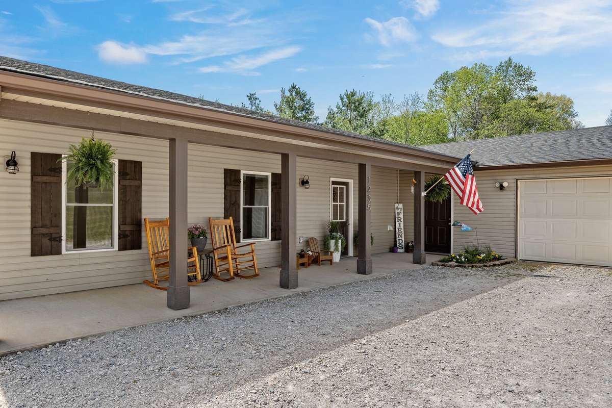 You will love how large this covered front porch is and the best part is... no stairs!