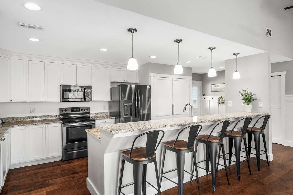 Imagine gathering the household and or friends around this over-sized bar for parties or get togethers. There is plenty of room for everyone to mingle.