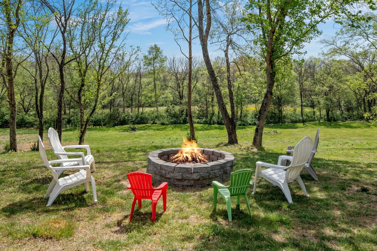 This backyard retreat boasts of mature trees, and peaceful wooded views. Come and cozy up on a cool crisp night beside this stone fire pit, roast smores with friends or simply sit in peace and enjoy under the night skies.