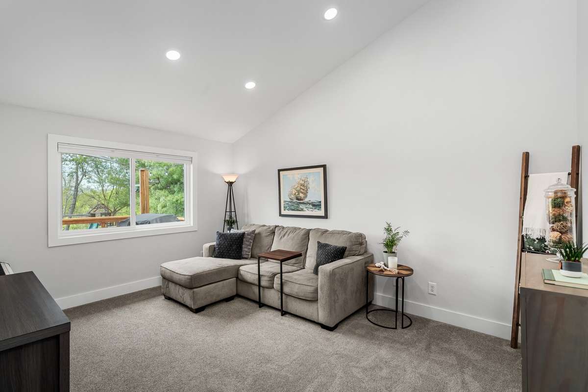 Additional living space is secluded on the opposite end of the bedrooms in the home making this a great option for a quiet space to work, exercise or simply just hang out.