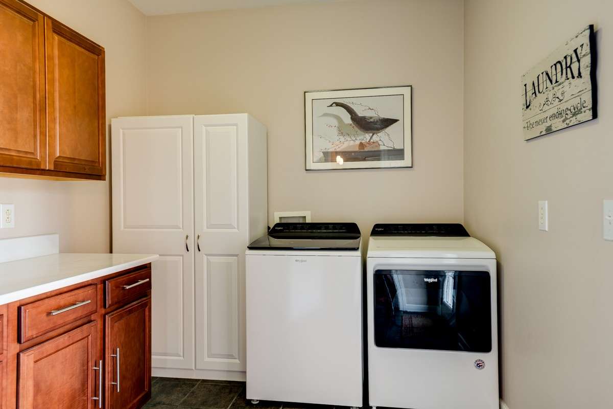 Large Laundry room with plenty of storage and sink for convenience (not pictured)