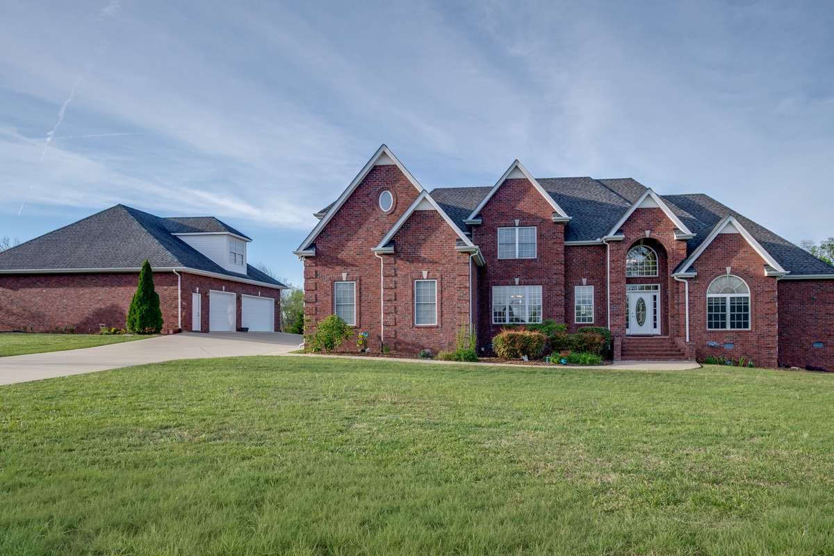 Beautiful brick home with 3 car attached garage and 3 car detached garage sits on 1 acre -
6 CAR GARAGE TOTAL