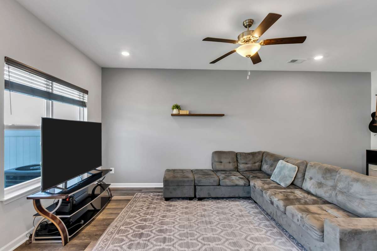 Large living room with lots of natural lighting.
