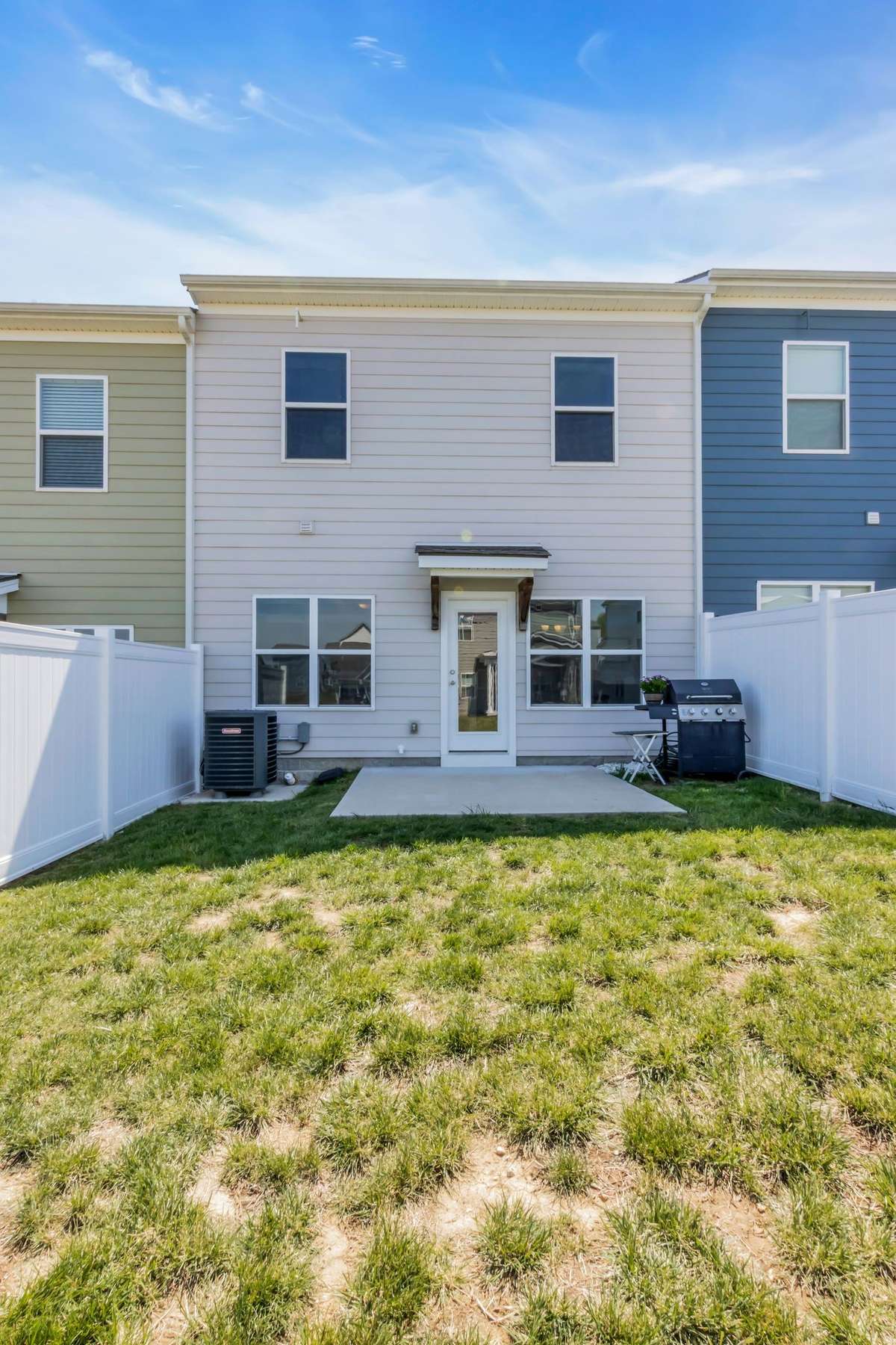 Spacious backyard with large patio space.
