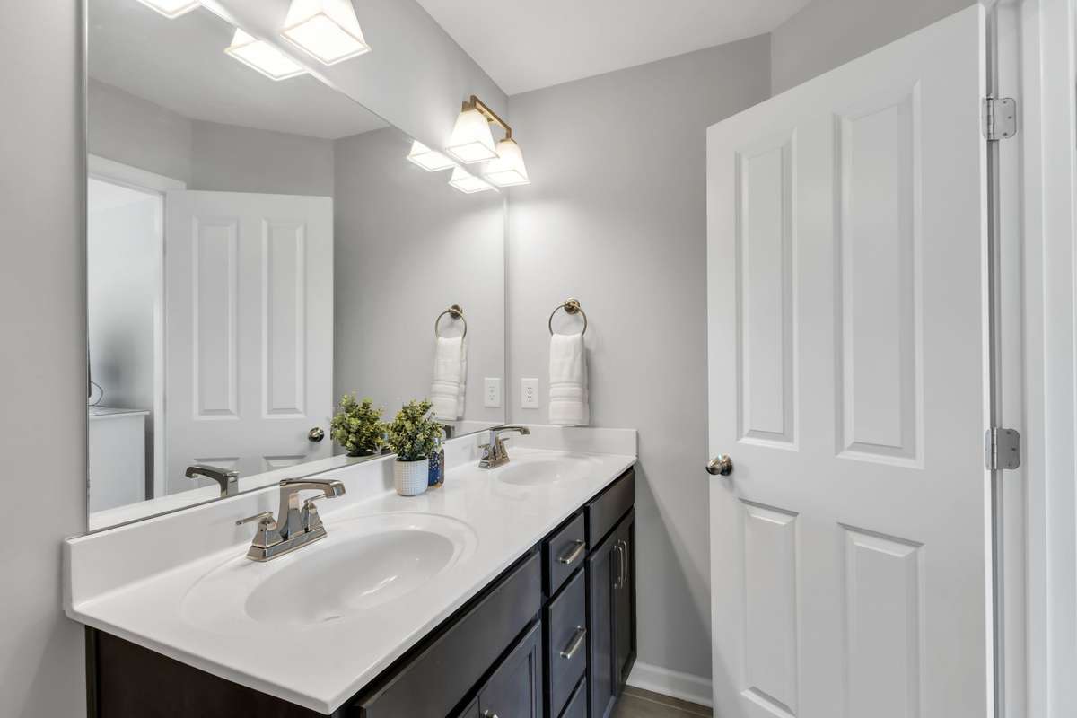 Primary bath features double vanities.