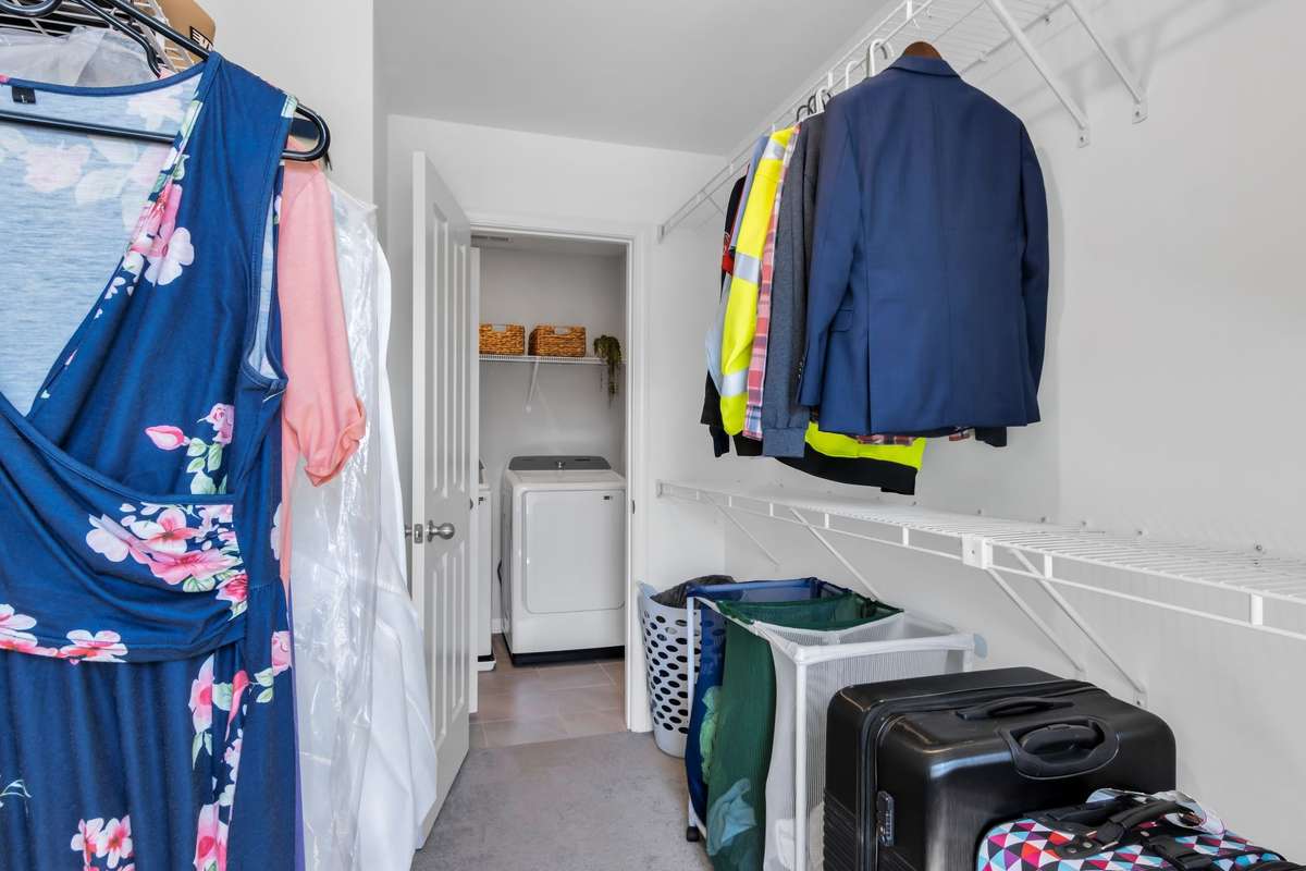 Walk in closet leads direclty into the upstairs laundry.