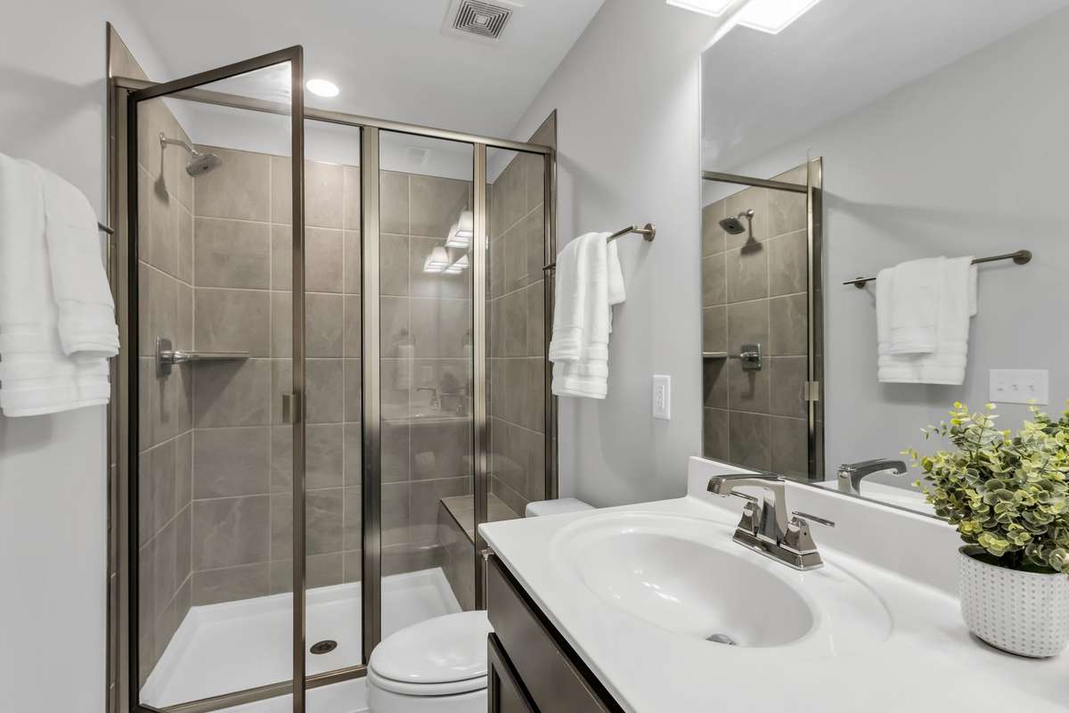 Primary Bath features large walk in shower.
