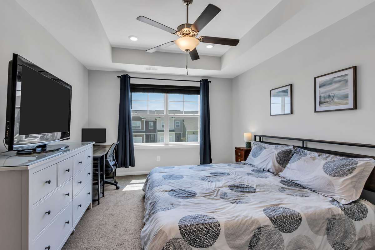 Primary Suite Upstairs with Trey Ceiling & Recessed lights.