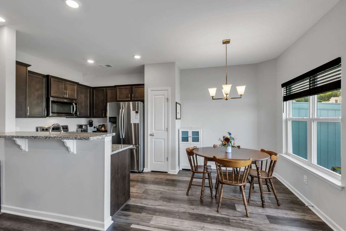 Dedicated dining space open to the kitchen - room for barstools at kitchen counter.