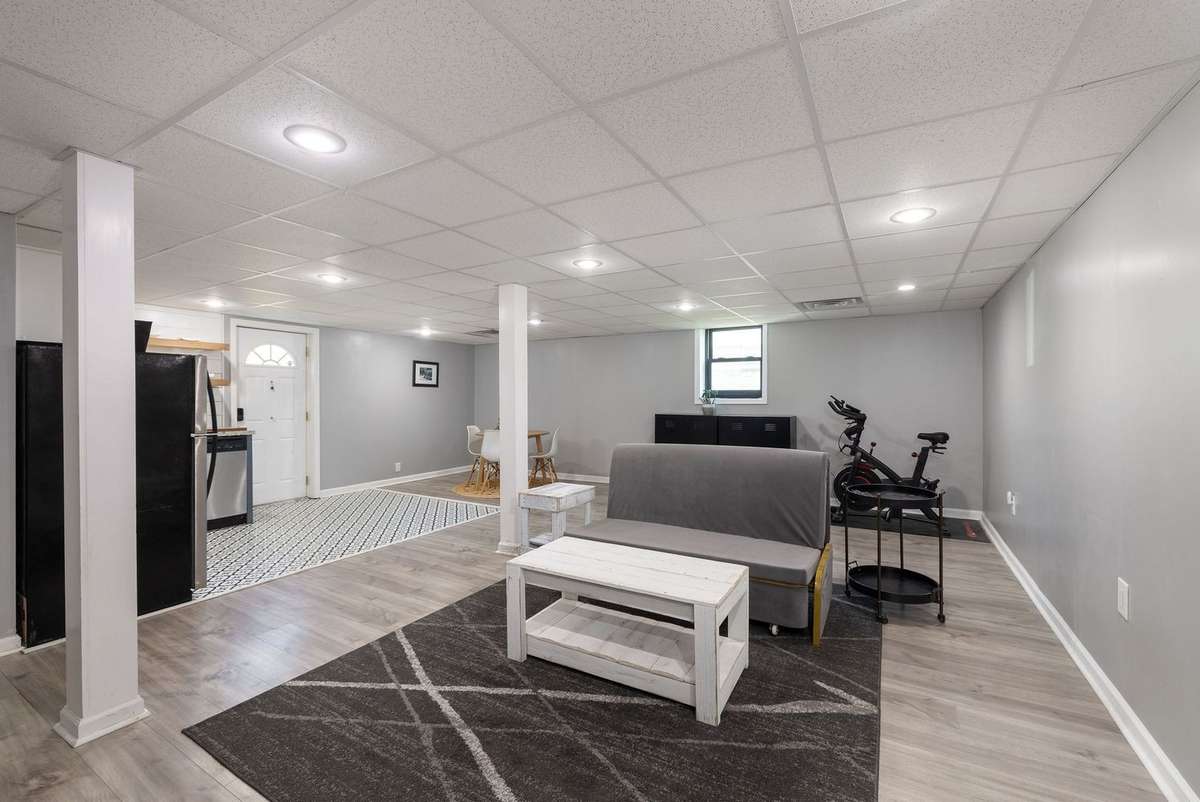 Copious amounts of space. Keep this area large or enclose the corner with the window for a 5th bedroom