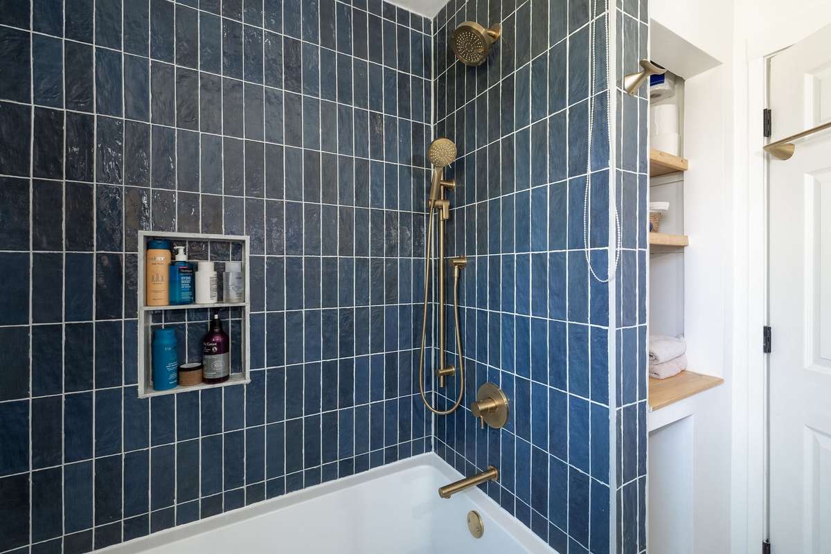Shower system with roll down shower curtain
