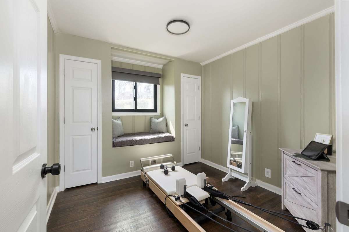 Original paneling and 2 closets in this sweet room