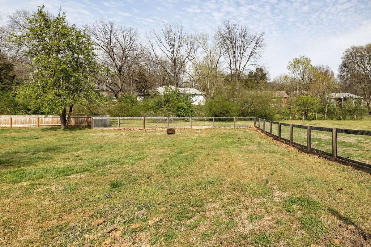 Over 1/2 an acre and fully fenced. This sprawling backyard is the place