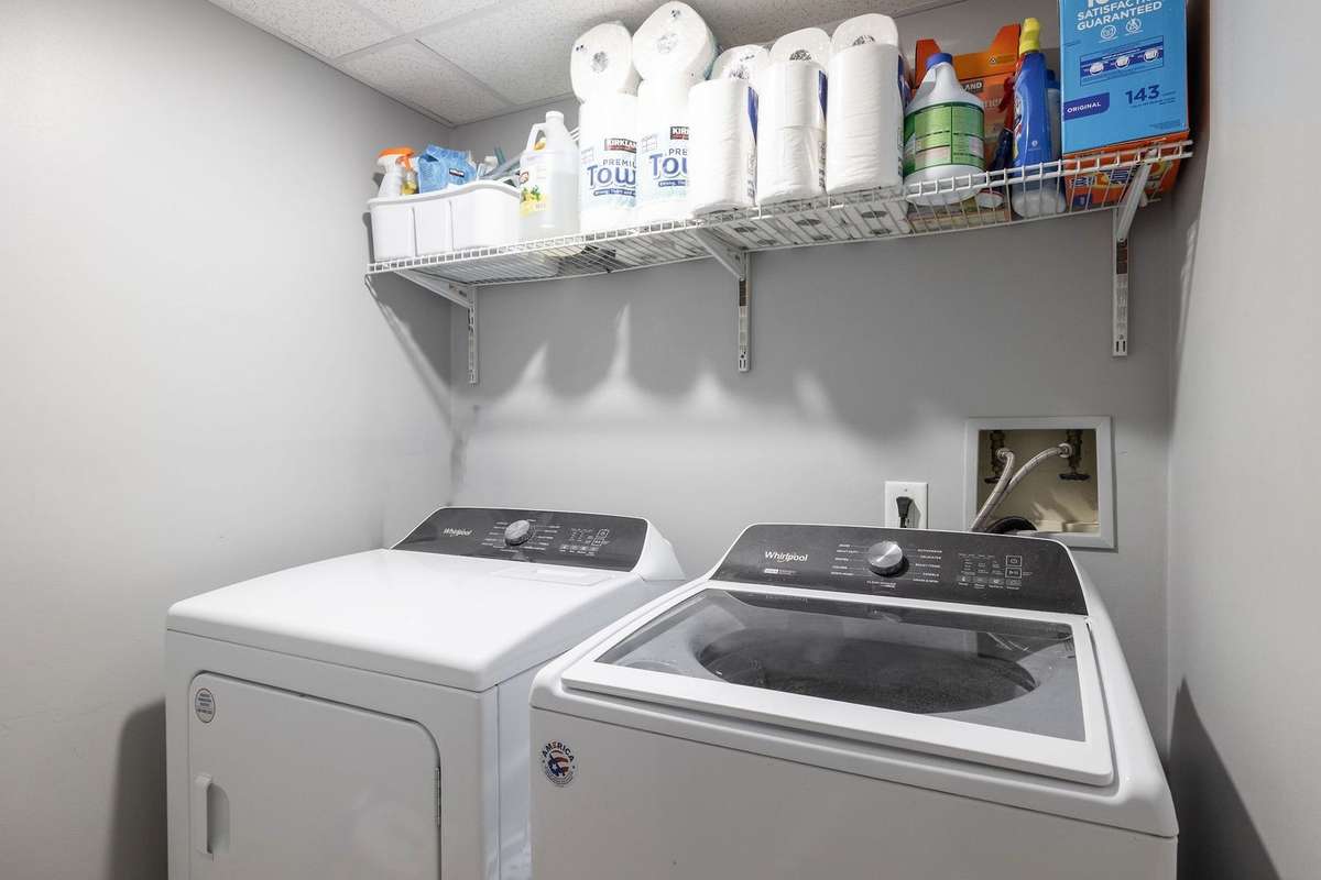 Utility room is downstairs. If you'd like to add a washer and dryer upstairs, the coat closet is deep enough for a small unit and the drop ceilings in the basement will make it simple to get water to the space.