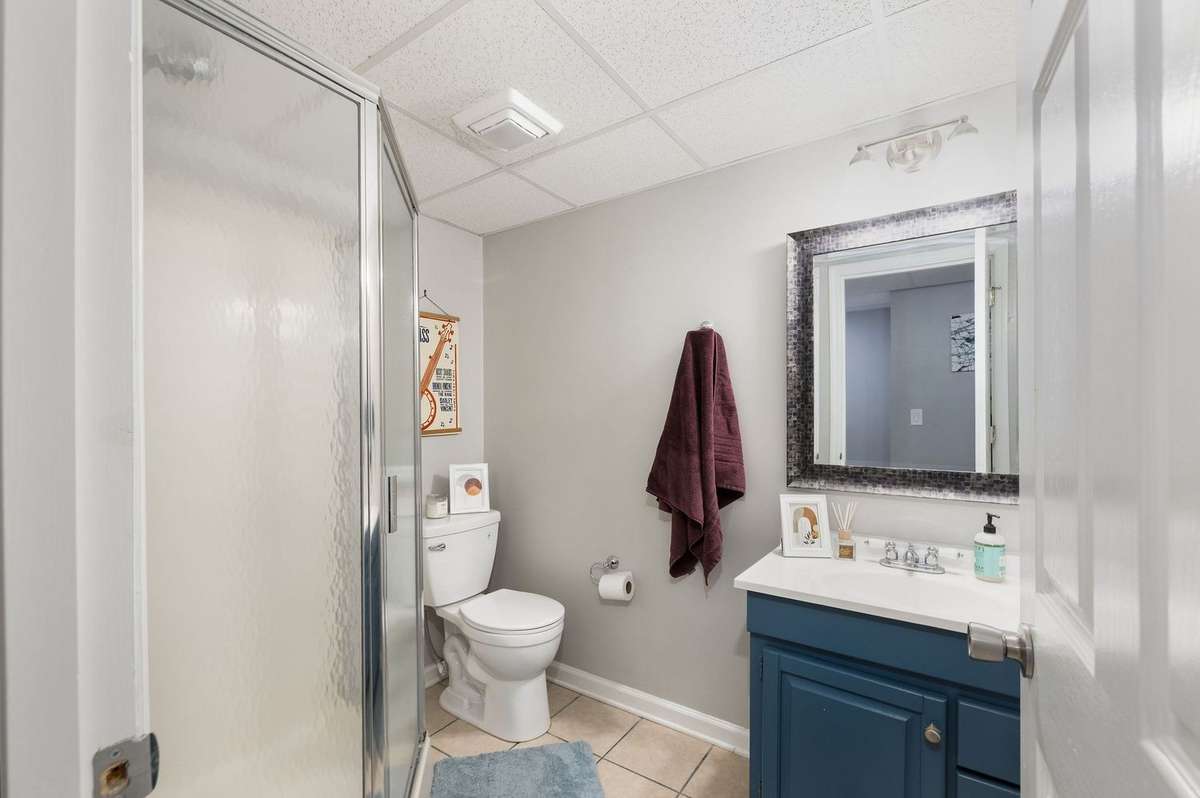 garden level apartment bathroom with walk in shower