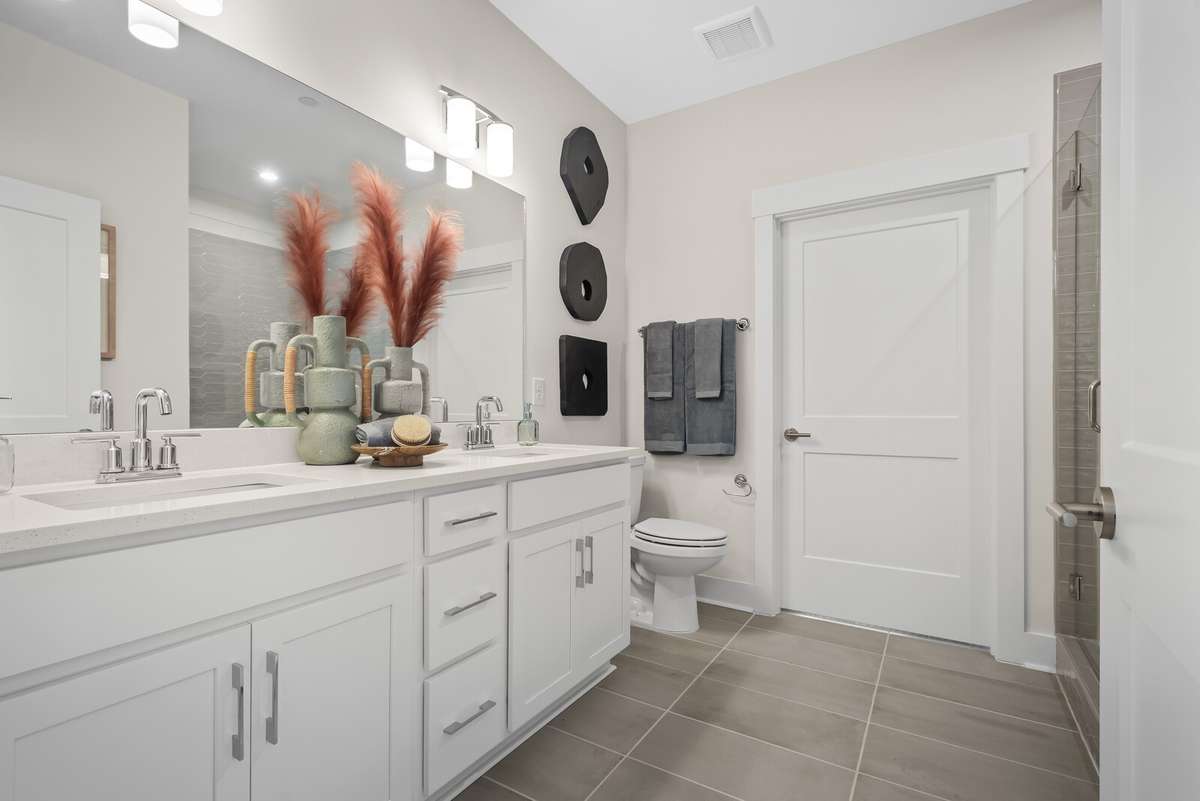 Photos shown are of a model home and are for illustrative purposes only. The actual home will vary in finishes, materials, colors, options, and upgrades. Buyers should verify all features and selections prior to purchase.