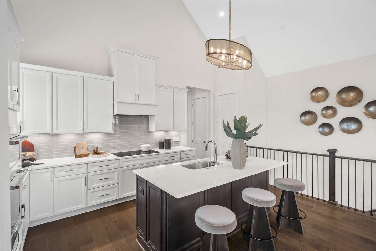 Photos shown are of a model home and are for illustrative purposes only. The actual home will vary in finishes, materials, colors, options, and upgrades. Buyers should verify all features and selections prior to purchase.