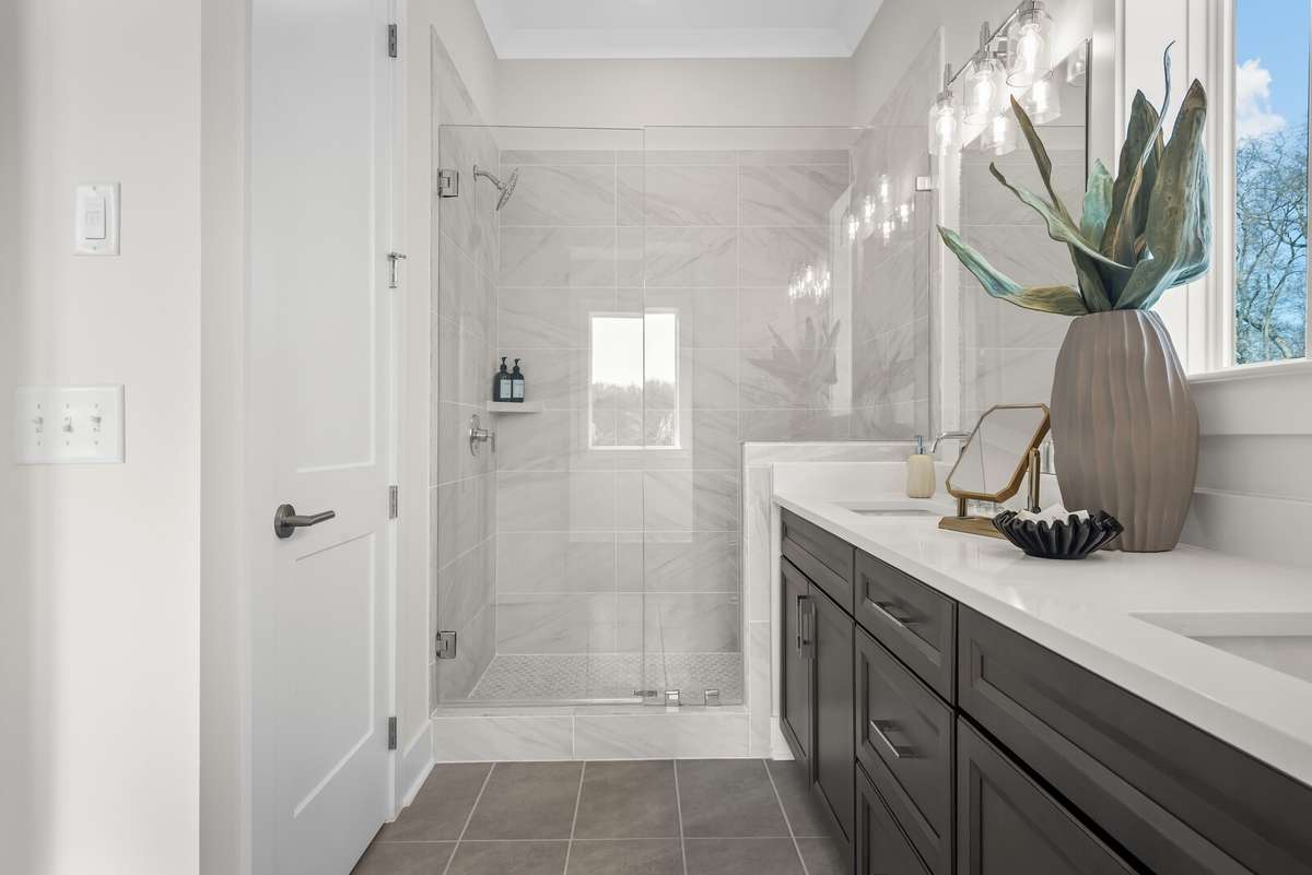 Photos shown are of a model home and are for illustrative purposes only. The actual home will vary in finishes, materials, colors, options, and upgrades. Buyers should verify all features and selections prior to purchase.