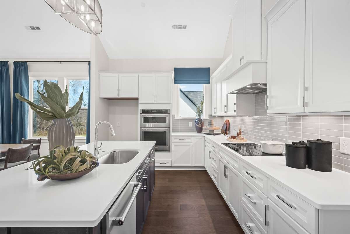 Photos shown are of a model home and are for illustrative purposes only. The actual home will vary in finishes, materials, colors, options, and upgrades. Buyers should verify all features and selections prior to purchase.