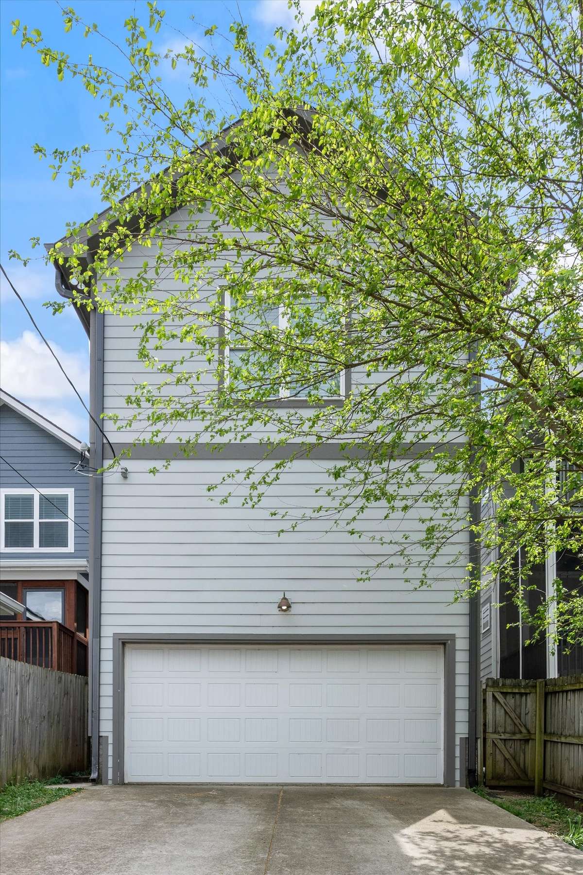 back of home, 2 door garage w/ tons of storage above.