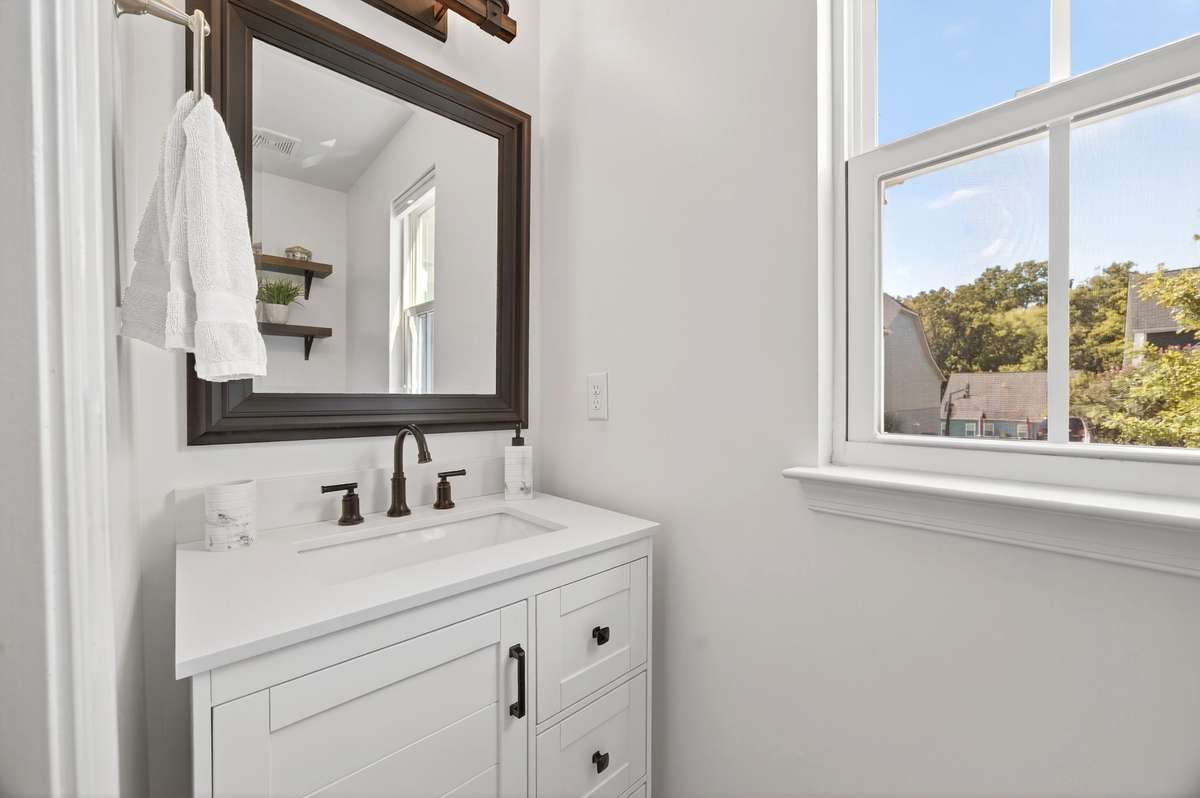 This half bath serves guests on the main level.