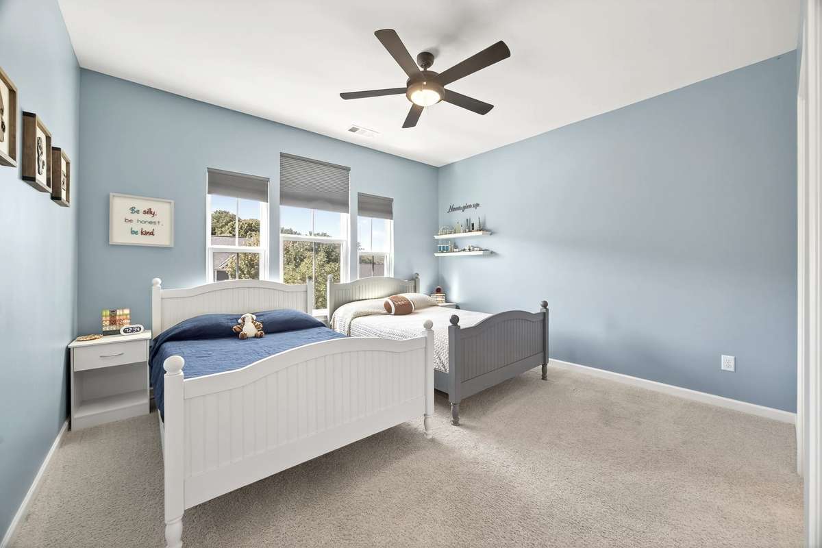 Another bedroom with walk-in closet and direct access to the full bath.