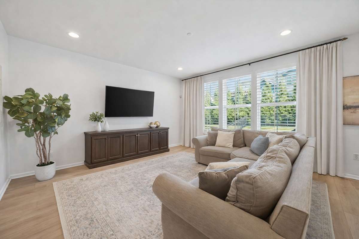 Bright and Inviting! (A virtual rug and curtains have been added to show the potential)