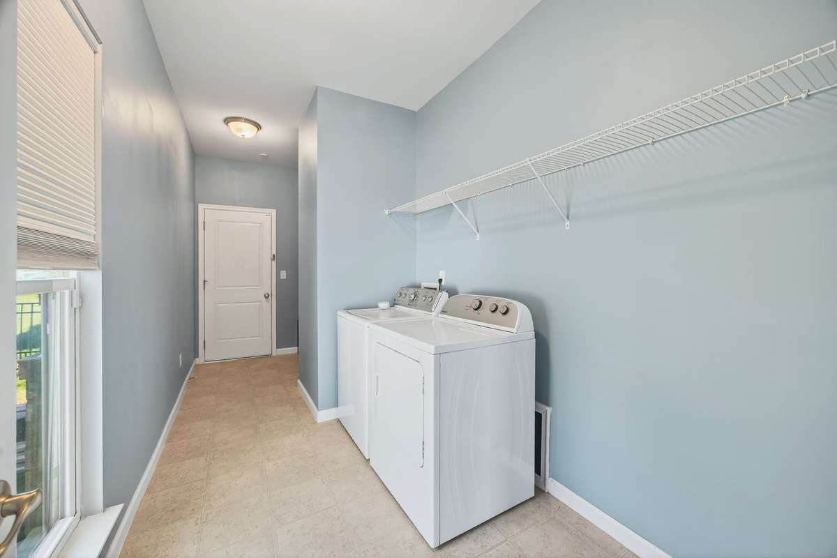 Located on the main level, this large laundry room has a separate "drop space/mudroom" just inside the garage.