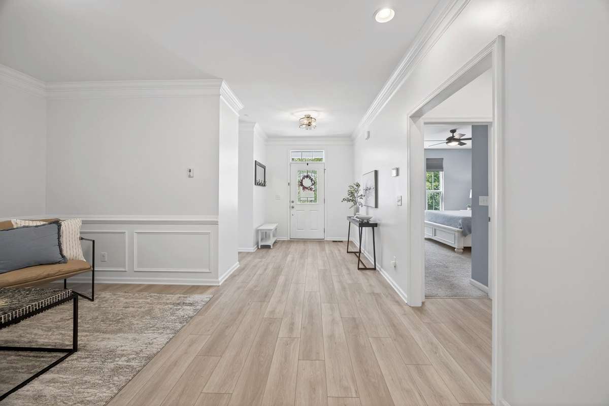 The entry sets a welcoming tone, connecting beautifully to the home's main entertaining spaces.