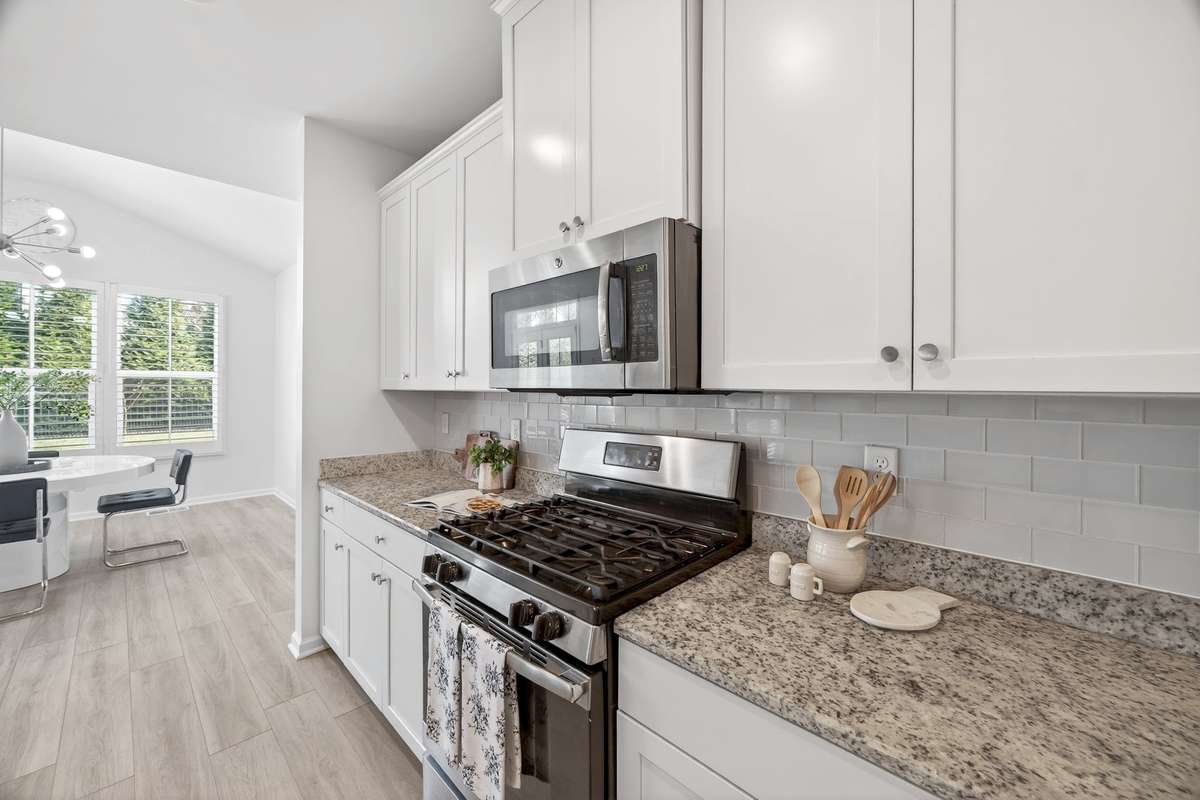 Built-in microwave and tiled backsplash.