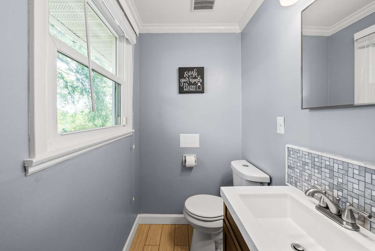 Bedroom 2 offers a private en suite half bath.