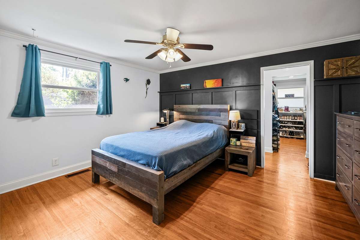 The Primary bedroom suite offers a dream closet with built in shelving and renovated bathroom with oversized shower.