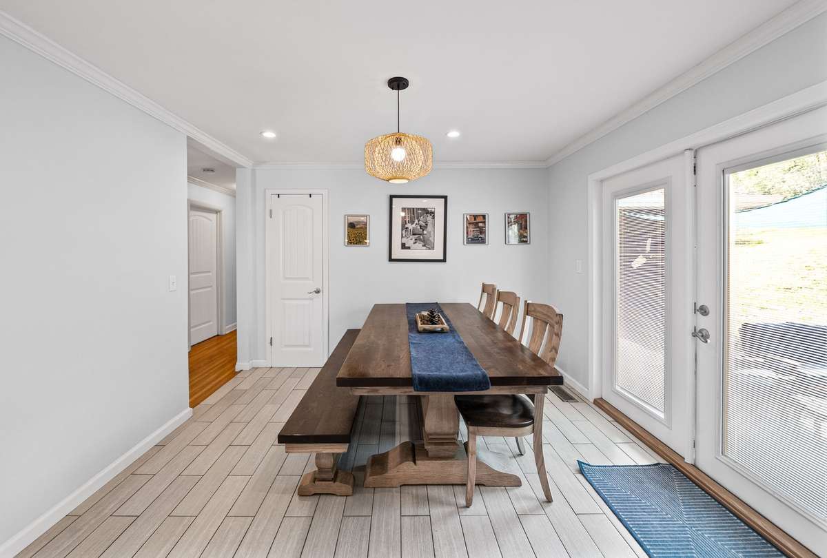Spacious eating area overlooking the back yard patio.