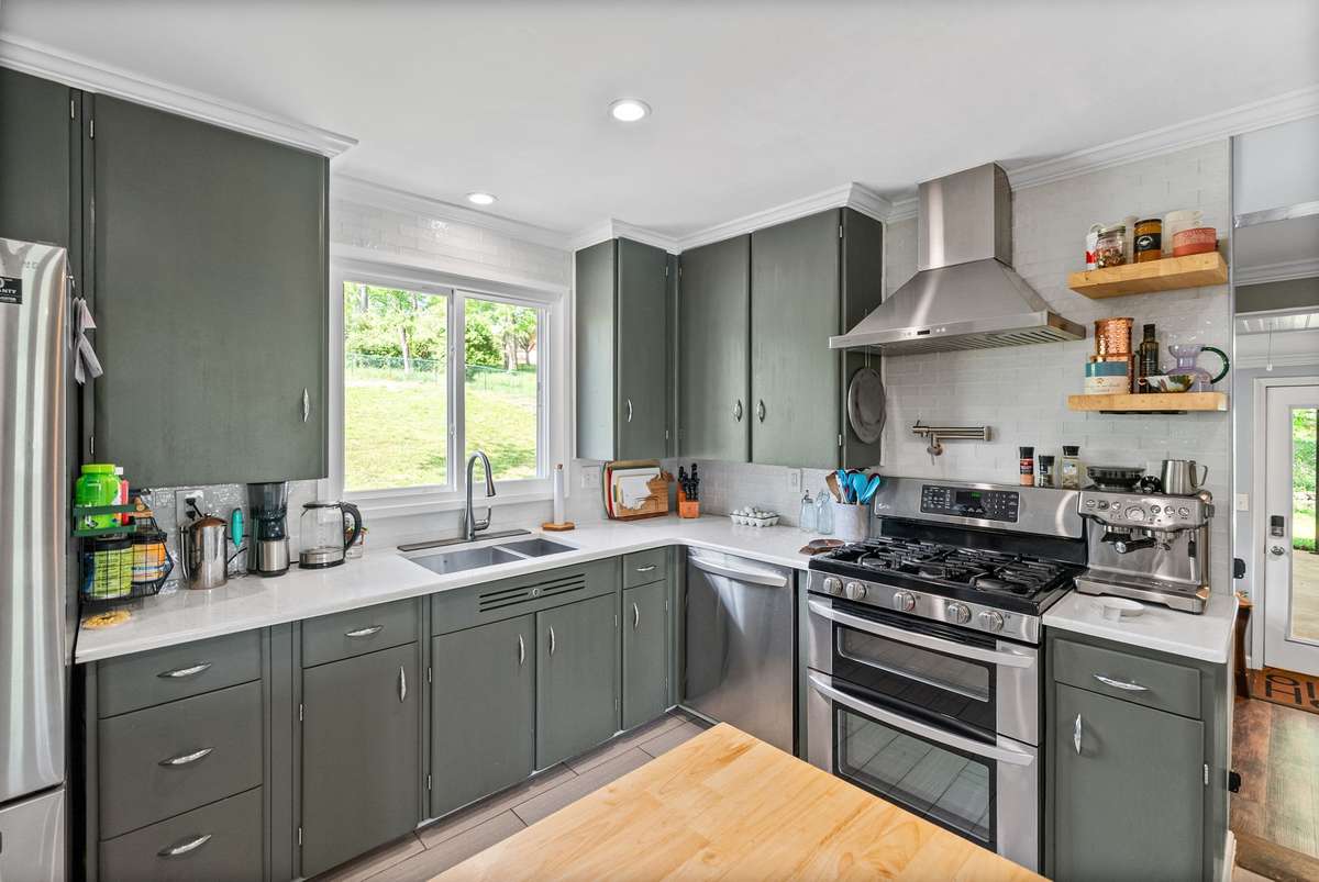 The heart of the home! Spacious and updated kitchen overlooking the back yard.