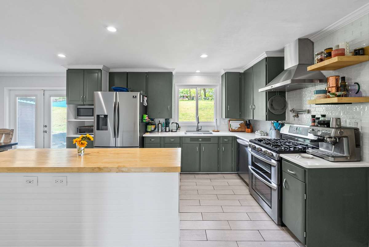 The heart of the home! Spacious and updated kitchen overlooking the back yard.