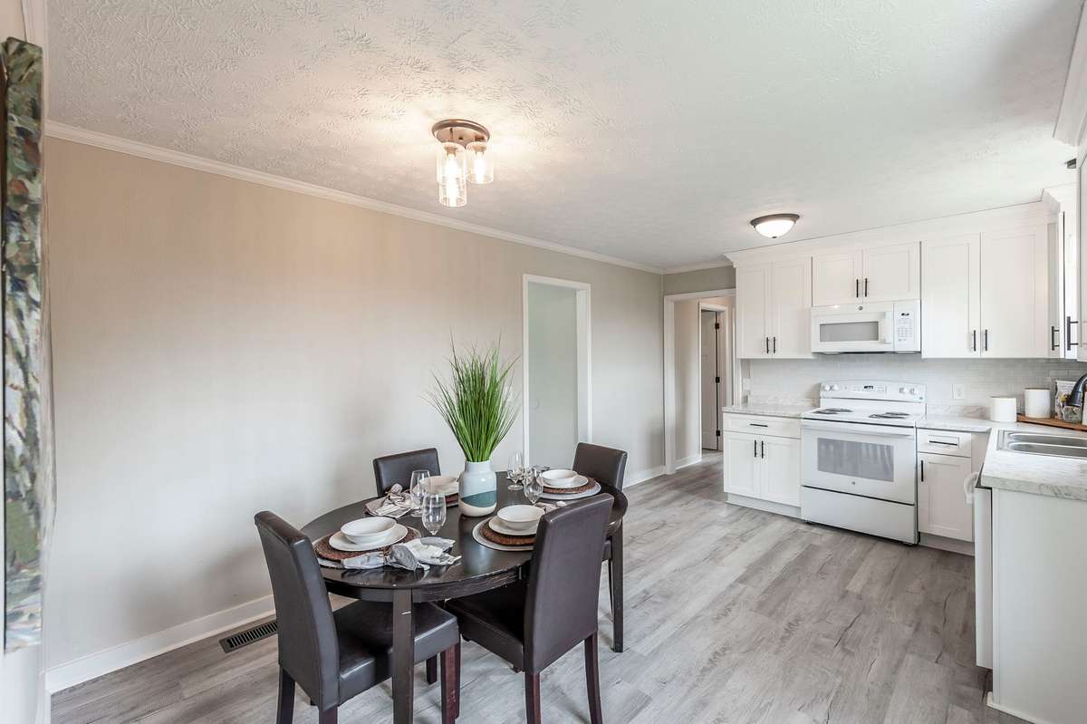 Positioned conveniently off the kitchen, the dining nook enhances the home’s functionality & easy living flow.