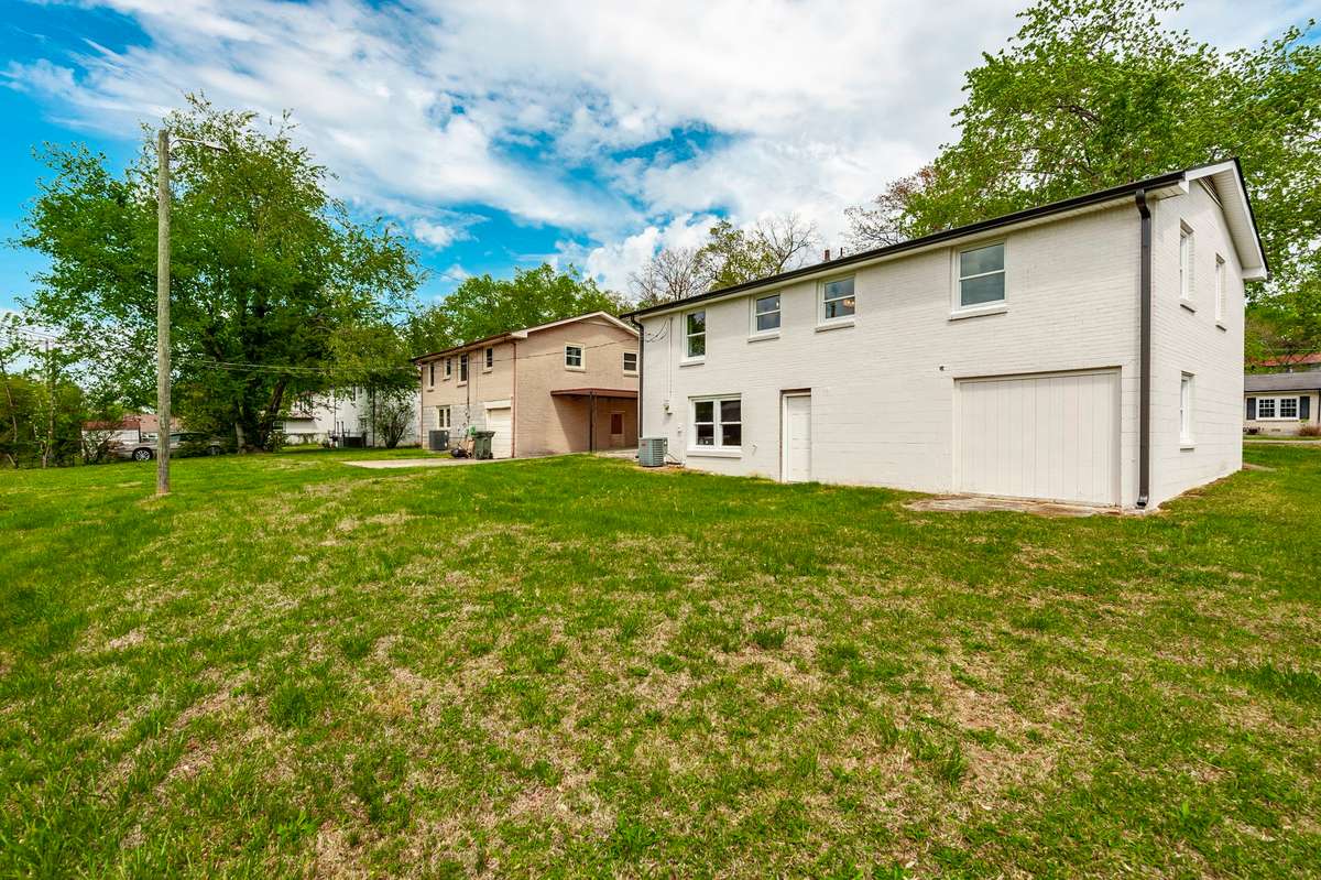The backyard also offers flexibility for adding a storage building, workshop, or additional outdoor structures as needed.