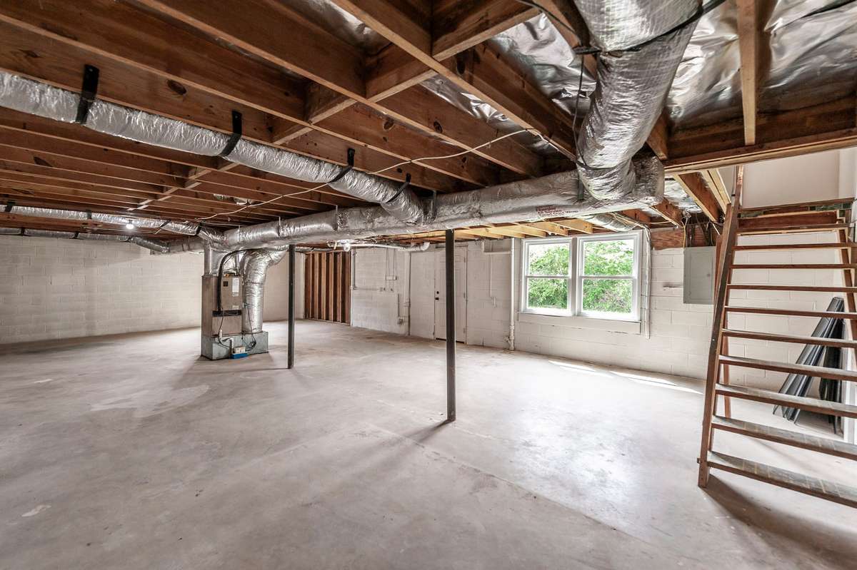 The full unfinished walkout basement offers an incredible amount of additional space & rare flexibility for future expansion.